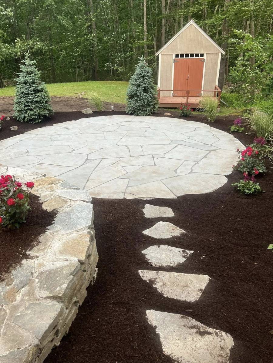 Stone patio and landscape installation
