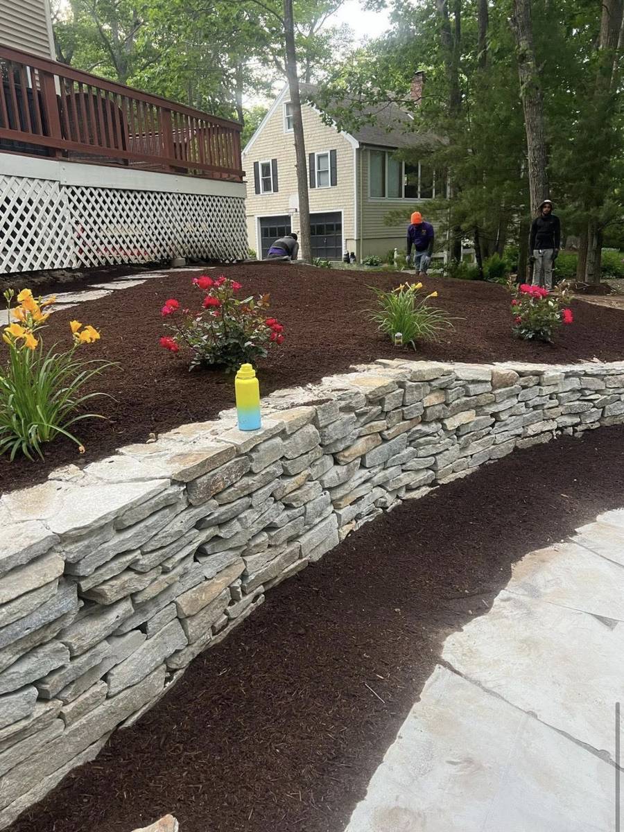 Retaining wall with mulch and flowers
